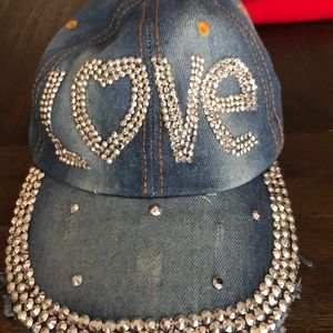 Magid, hat with love written with jewels.